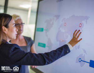 Arlington Real Estate Investors Looking at International Properties on a Large Screen