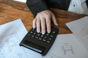 a person making calculations with a calculator