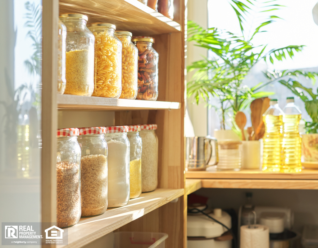 Organized Pantry with Food Items Stored in Glass Containers