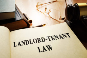 Landlord-Tenant Law Book Open on a Desk