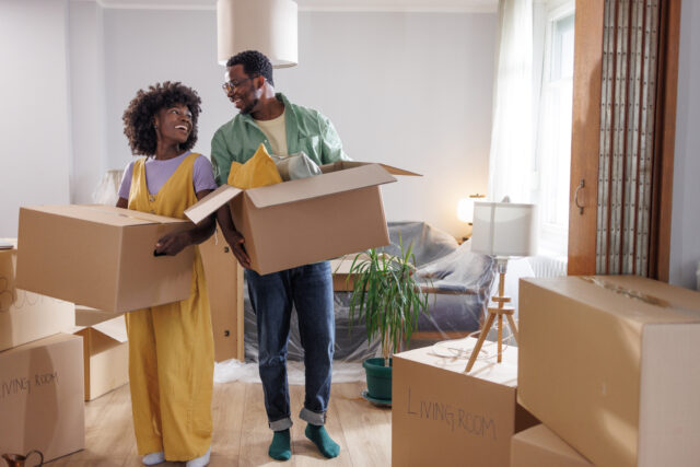 Young couple finding happiness in the little moments of moving into a new home a couple unpacking boxes