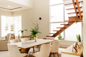 modern and bright dining room with staircase