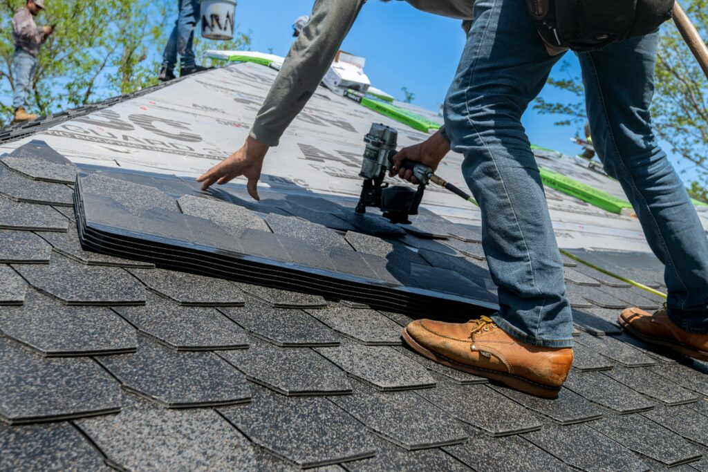 A contractor repairing a roof.