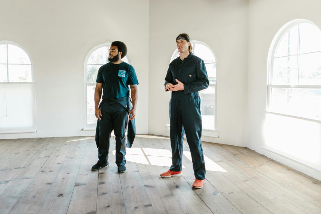 Two service workers examining a residential property.