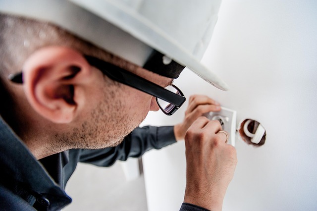 A maintenance man checking a plug