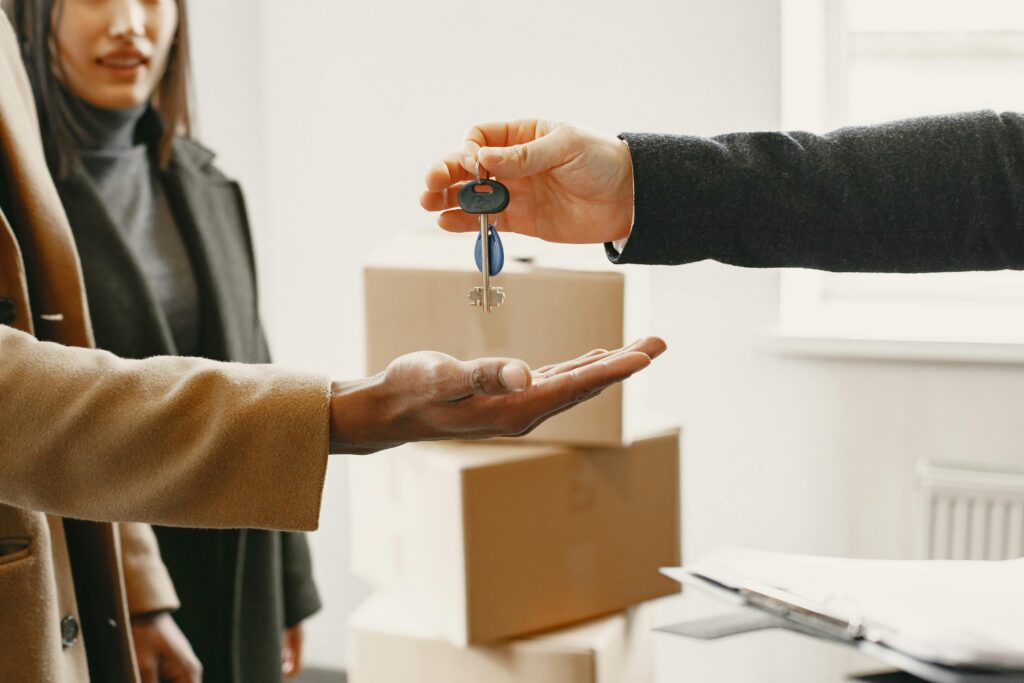Landlord handing over keys to quality tenants