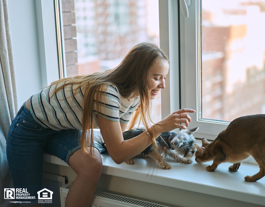 Tenant Playing with Her Cat and Dog in a Small Portland