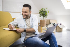 Happy landlord making an inventory list for his furnished rental property