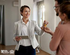 Property Manager Handing Over Keys to New Tenants