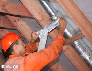 Man Wrapping Pipes in a Ojai Rental Property