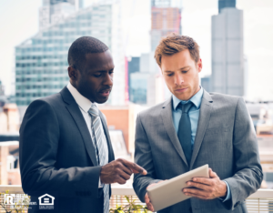 Two Westlake Village Investors Discussing a Project in Front of a City Skyline