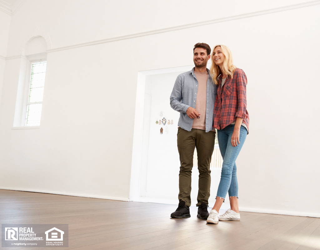 Couple Taking Self-Guided Property Tour in Huntington Woods