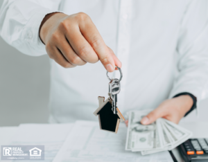 Man Holding Cash and Handing Over Keys