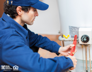 Plumber Working on a Water Heater in a Mission Viejo Rental