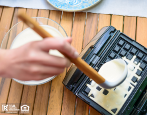 Taunton Tenant Making Waffles in a Waffle Iron