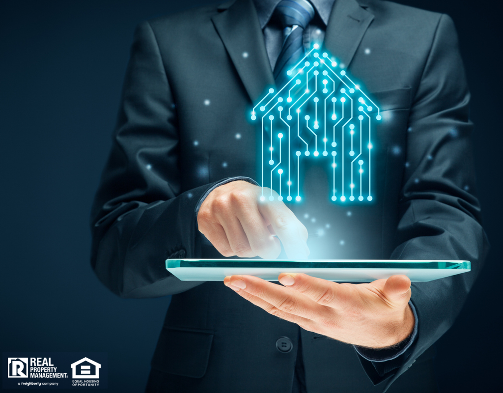Business Man Holding a Tablet with a Holograph of a Home Above It