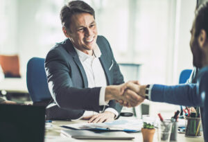 Business partners greeting each other with a handshake.