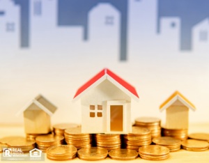 Miniature Houses on a Piles of Coins