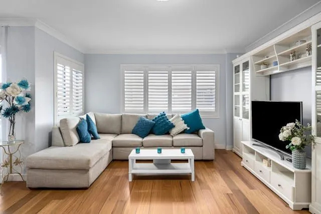 a-blue-and-white-living-room-with-a-large-white-couch