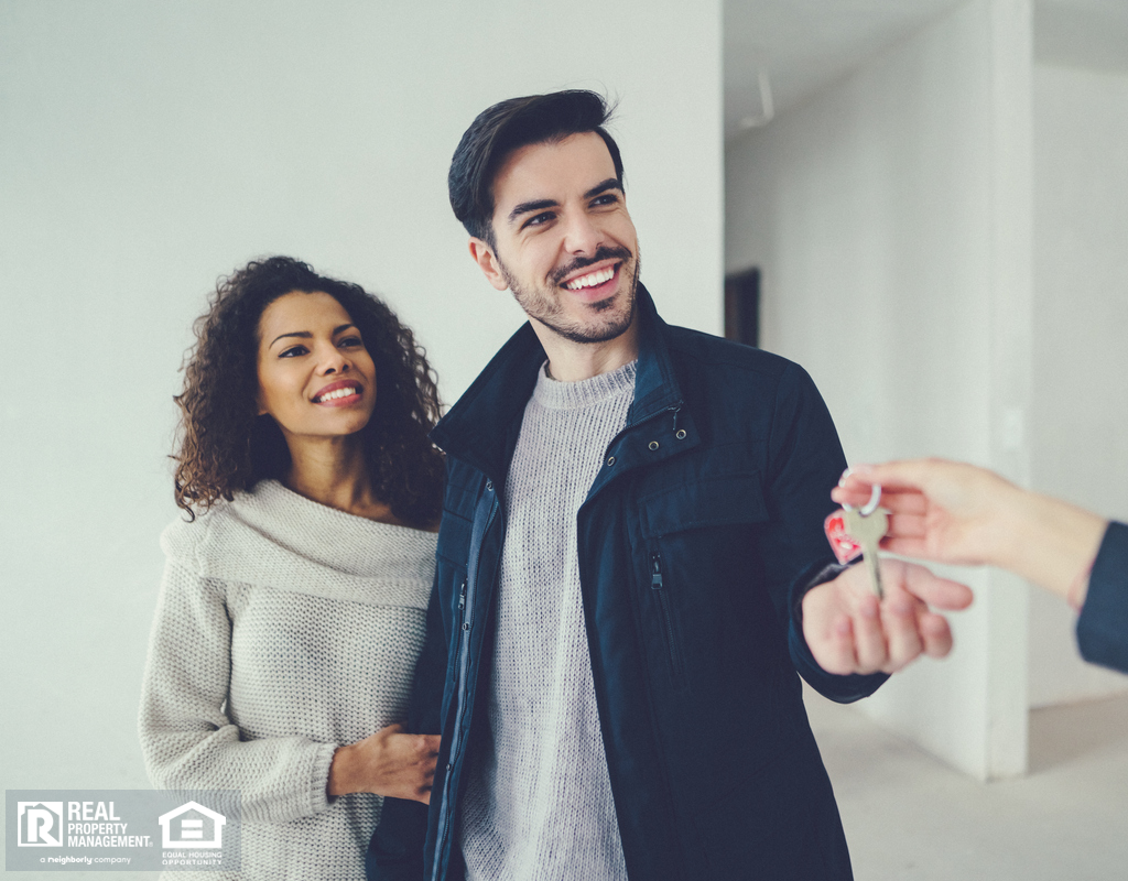 Clever Tenants Receiving Keys to their Rental