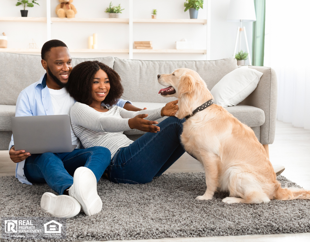 Happy Tenants Playing with Their Dog in a Pet-Friendly Atlanta Rental