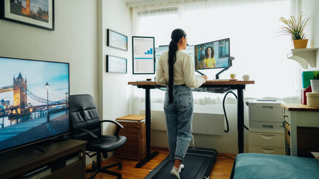 Young female resident working in her rental home.