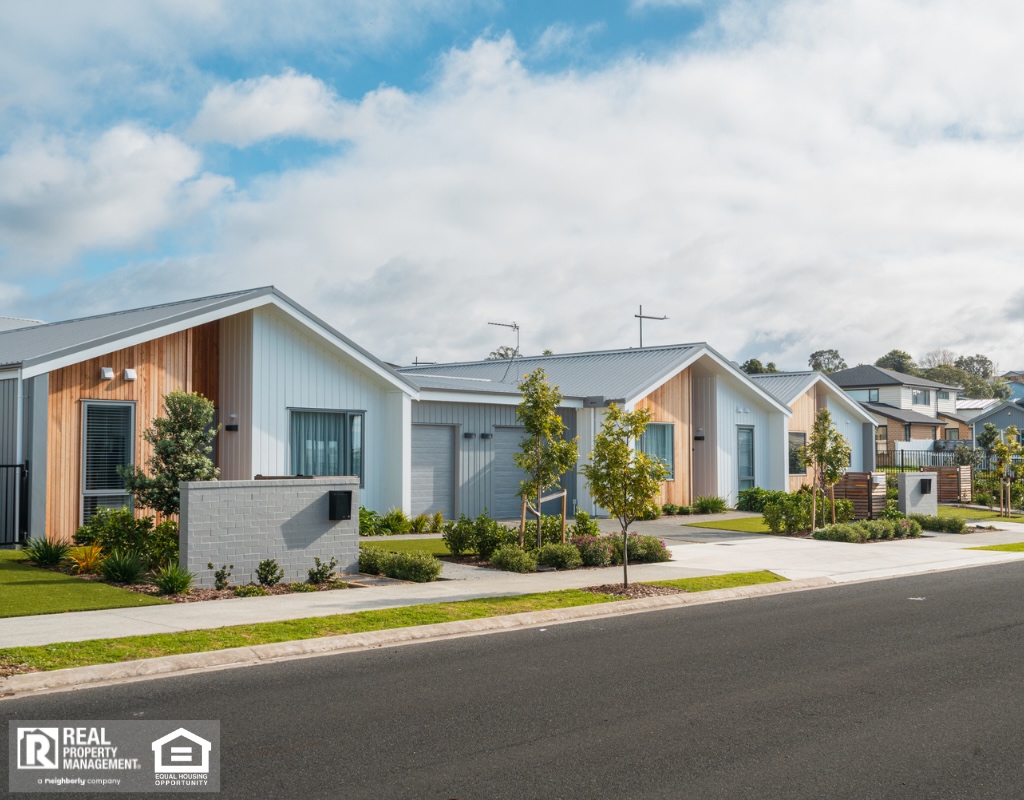 Row of single story newly developed houses.