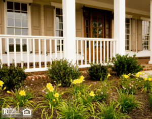 Front porch with low-maintenance shrubs and blooms.