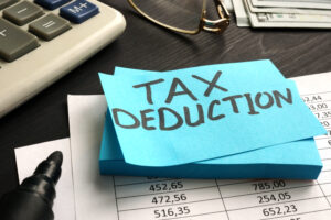 Tax deduction written on a piece of paper. 