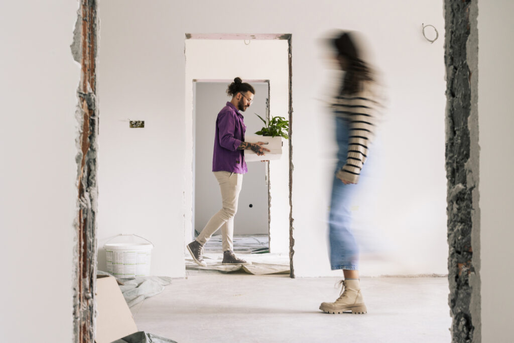 Portrait of happy couple moving to new home