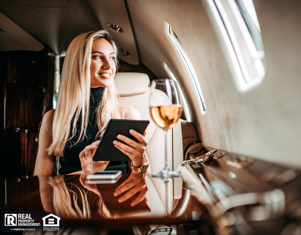 Businesswoman Holding a Tablet on a Private Jet