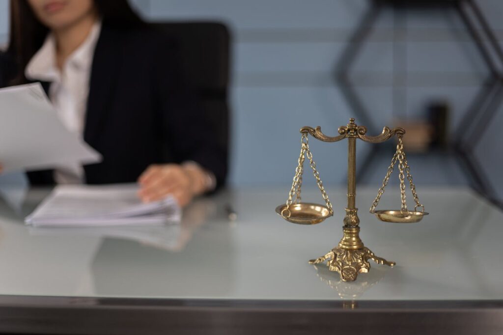 legal scales and person writing