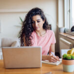 Young woman and tenant applying for renters insurance online.