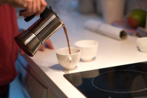 Katy Renter Pouring a Cup of Coffee from a Moka Pot 