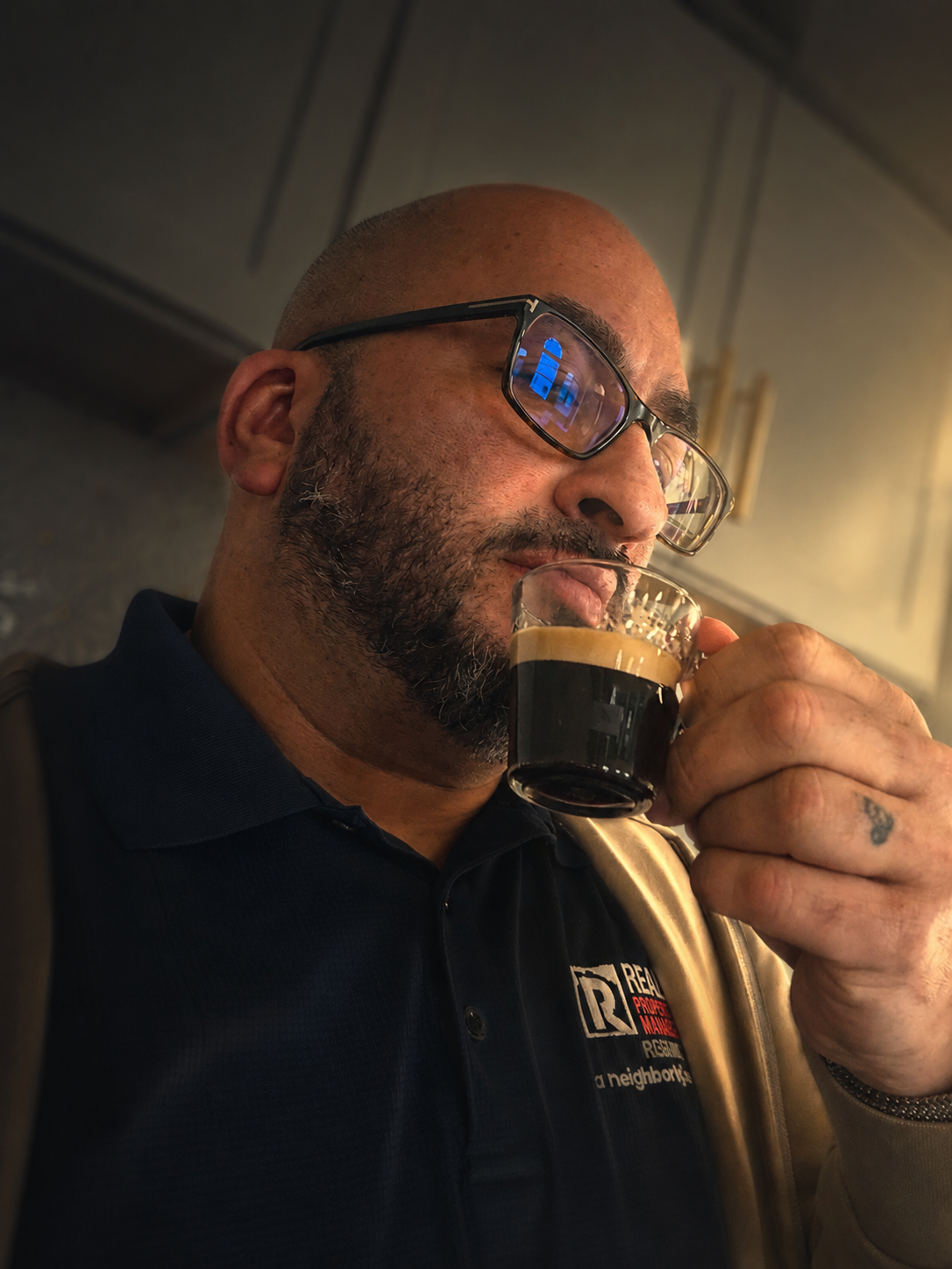 Stephen Guasp drinking espresso while reflecting on leadership business growth and rental property investing in Virginia