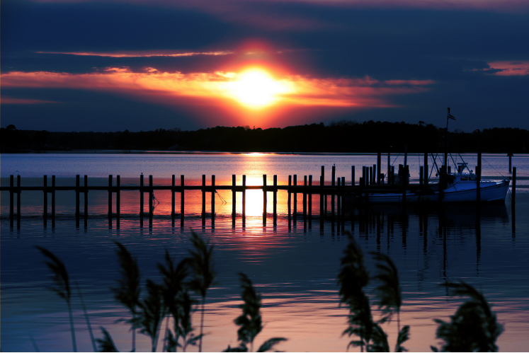 Virginia waterfront sunset representing home, community, and military families building roots