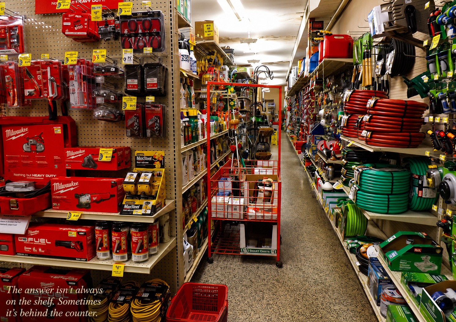 Aisle inside a local hardware store filled with tools, hoses, supplies, and shelves, representing practical experience and local knowledge.