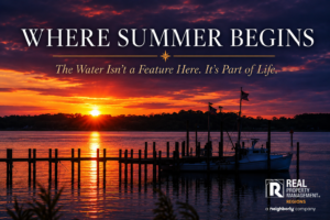 Sunset over Monroe Bay in the Virginia Northern Neck with a waterman boat docked along the waterfront.