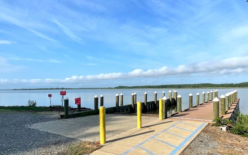 Public boat ramp extending into the water along Virginia's Northern Neck during summer.