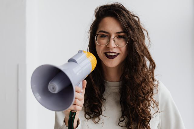 a person holding up a megaphone
