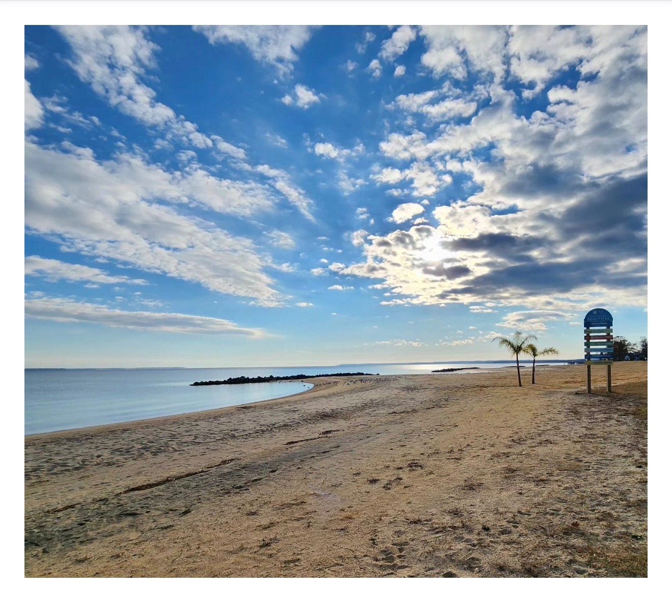 Colonial Beach waterfront in Virginia under a bright summer sky.
