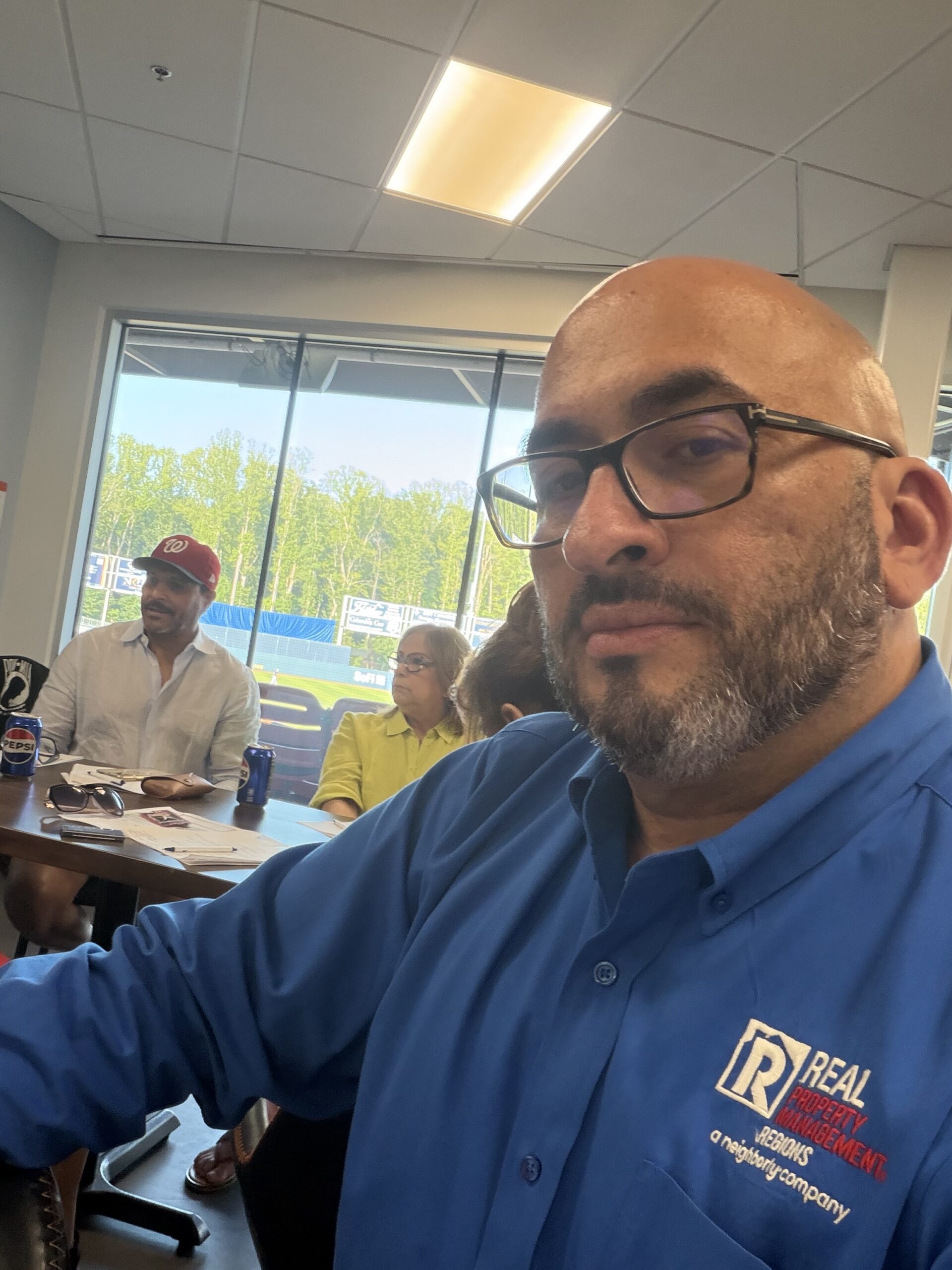Stephen Guasp presenting the Real Property Management Regions Day of Service to members of the PUENTES Hispanic Business Networking Group.