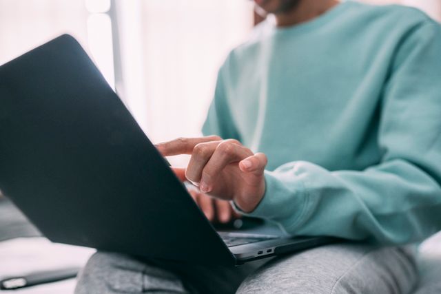 a person typing on a laptop