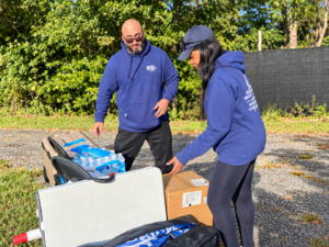 Stephen and Phyllis Guasp preparing supplies for the 2026 Real Property Management Regions Day of Service