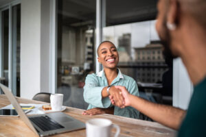 Real estate investor shaking hands to close a deal.
