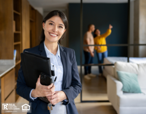 Smiling property manager with happy tenants looking at the home.
