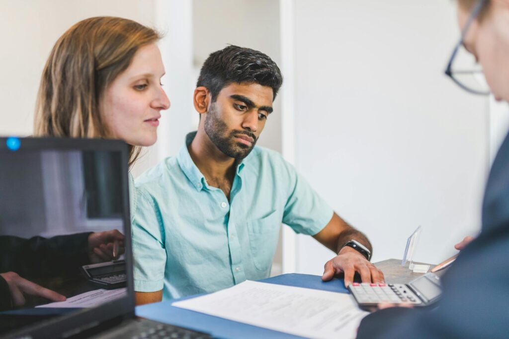 people talking at a desk