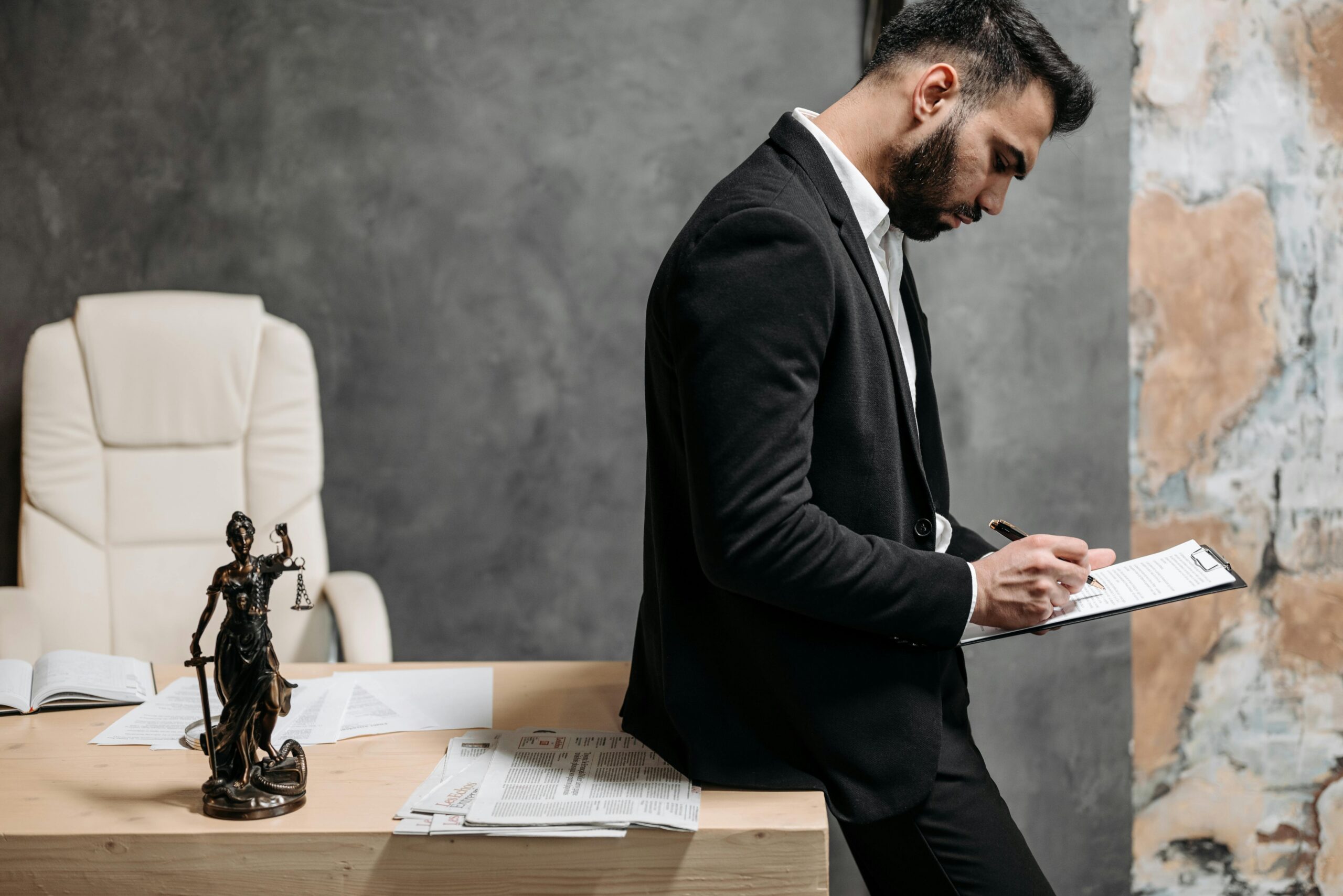 man leaning on a desk