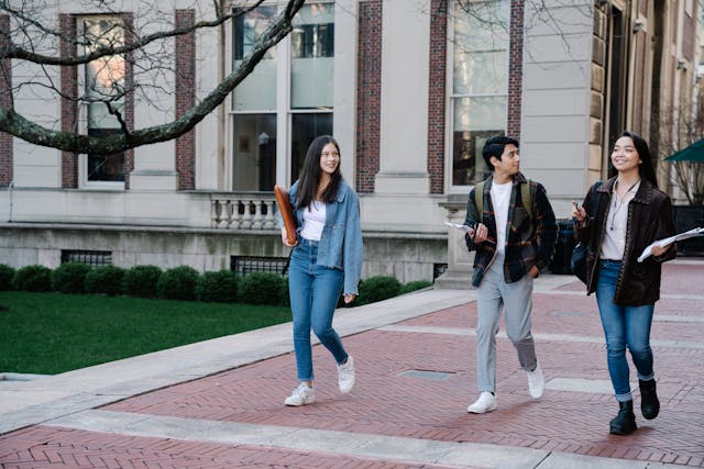 three students walking on campus
