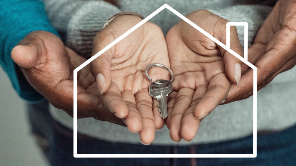 people holding house keys